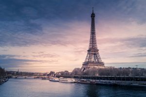 Eiffel Tower beside the Seine River at sunset in Paris