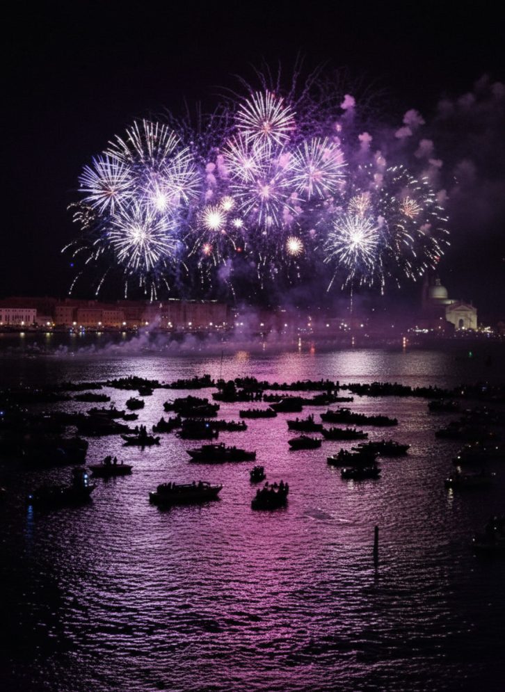 Fireworks lighting up the night sky above the Venetian Lagoon during the Festa del Redentore celebration in Venice, Italy.