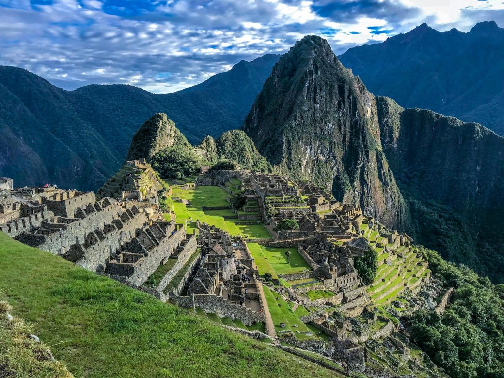 Machu Picchu surrounded by mountains in Peru during sunrise
