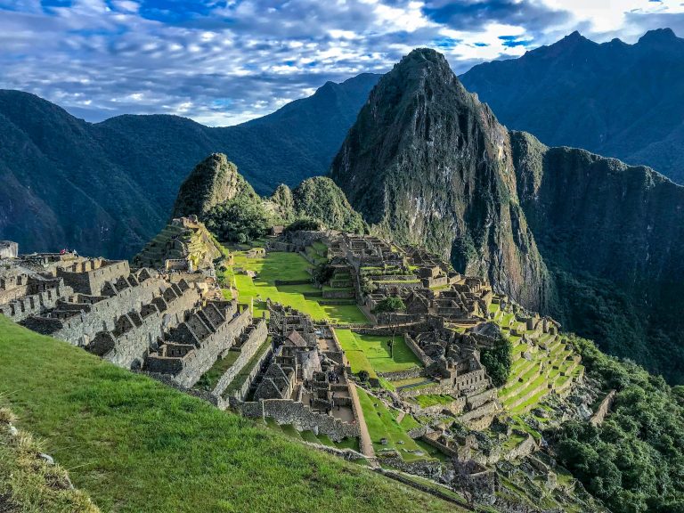 Machu Picchu surrounded by mountains in Peru during sunrise