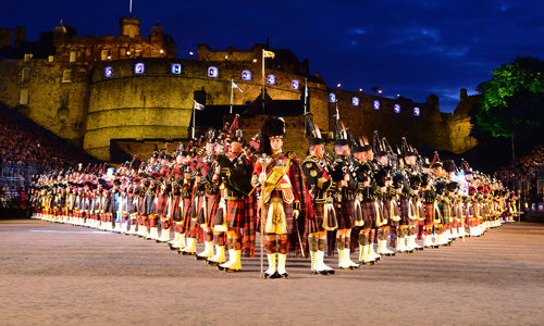 Massed pipes and drums performing at the Royal Edinburgh Military Tattoo outside Edinburgh Castle