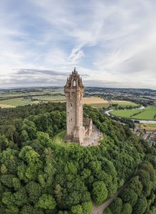 The National Wallace Monument rising above woodland near Stirling.