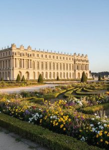 The Palace of Versailles overlooking its formal gardens in France
