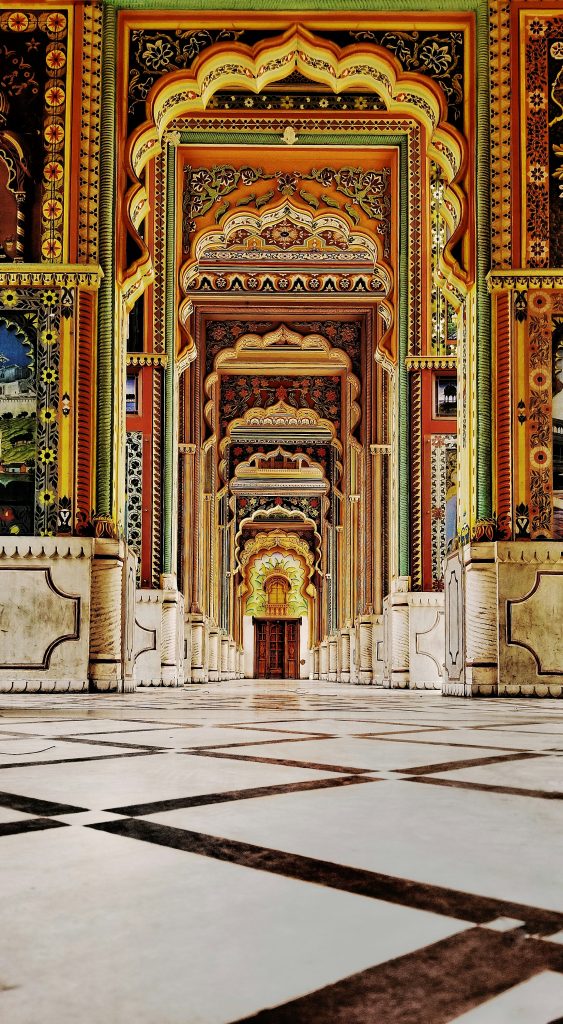 Intricate Rajasthani architecture and painted archways inside Patrika Gate in Jaipur