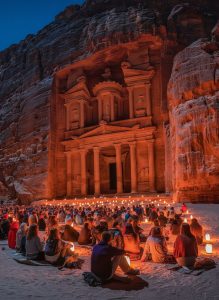 Visitors gathered before the illuminated Treasury during the Petra by Night candlelight experience in Jordan.