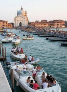 Visitors crossing the temporary pontoon bridge linking Venice to Giudecca during the Festa del Redentore celebration.