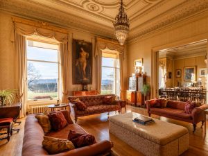 Elegant drawing room with antique furnishings in a Scottish country house hotel.