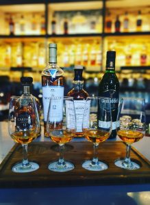 A whisky tasting flight featuring several Speyside single malt whiskies.