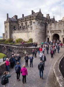 Visitors walking across the entrance bridge to Stirling Castle.