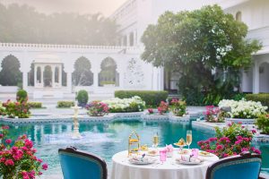 Courtyard pool and outdoor dining area at at the Taj Lake Palace hotel in Udaipur, India