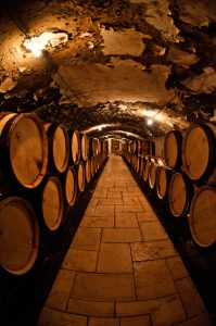 Wine barrels inside a traditional champagne cellar in France