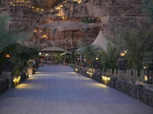 Entrance walkway leading into a modern desert glamping resort in Wadi Rum, Jordan.