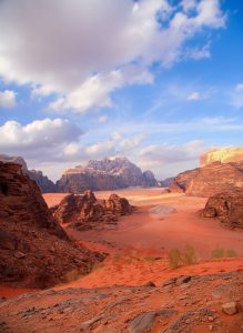 Panoramic view of Wadi Rum's sandstone mountains and red desert